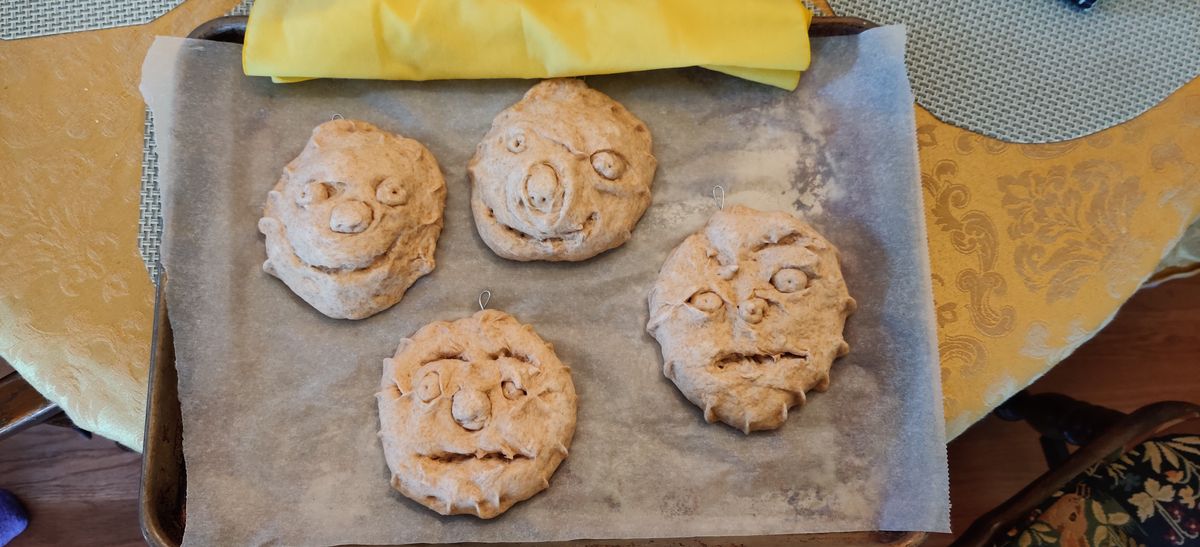 Maria making the bread faces, 6-9-2019