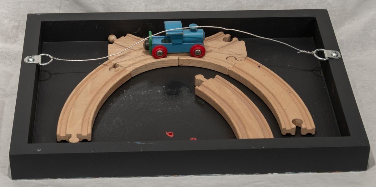 Person Playing with Wooden’ Train Doing the Splits, 5-4-2021